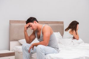 Family conflict with wife and husband in bed